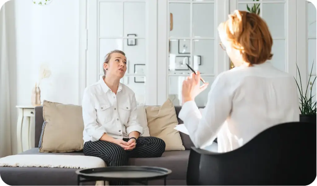 Therapist counseling a patient during a mental health and dual diagnosis treatment session
