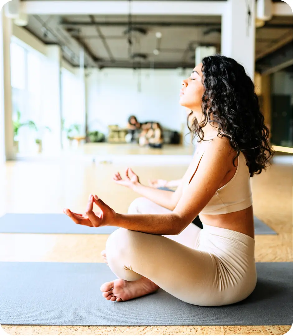 Woman practicing yoga and movement therapy during addiction recovery treatment