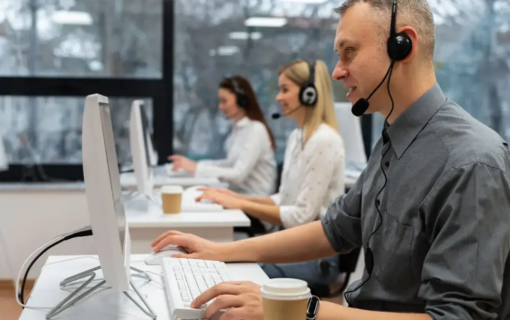 Professional support staff providing 24/7 concierge and client care services in a luxury addiction recovery setting