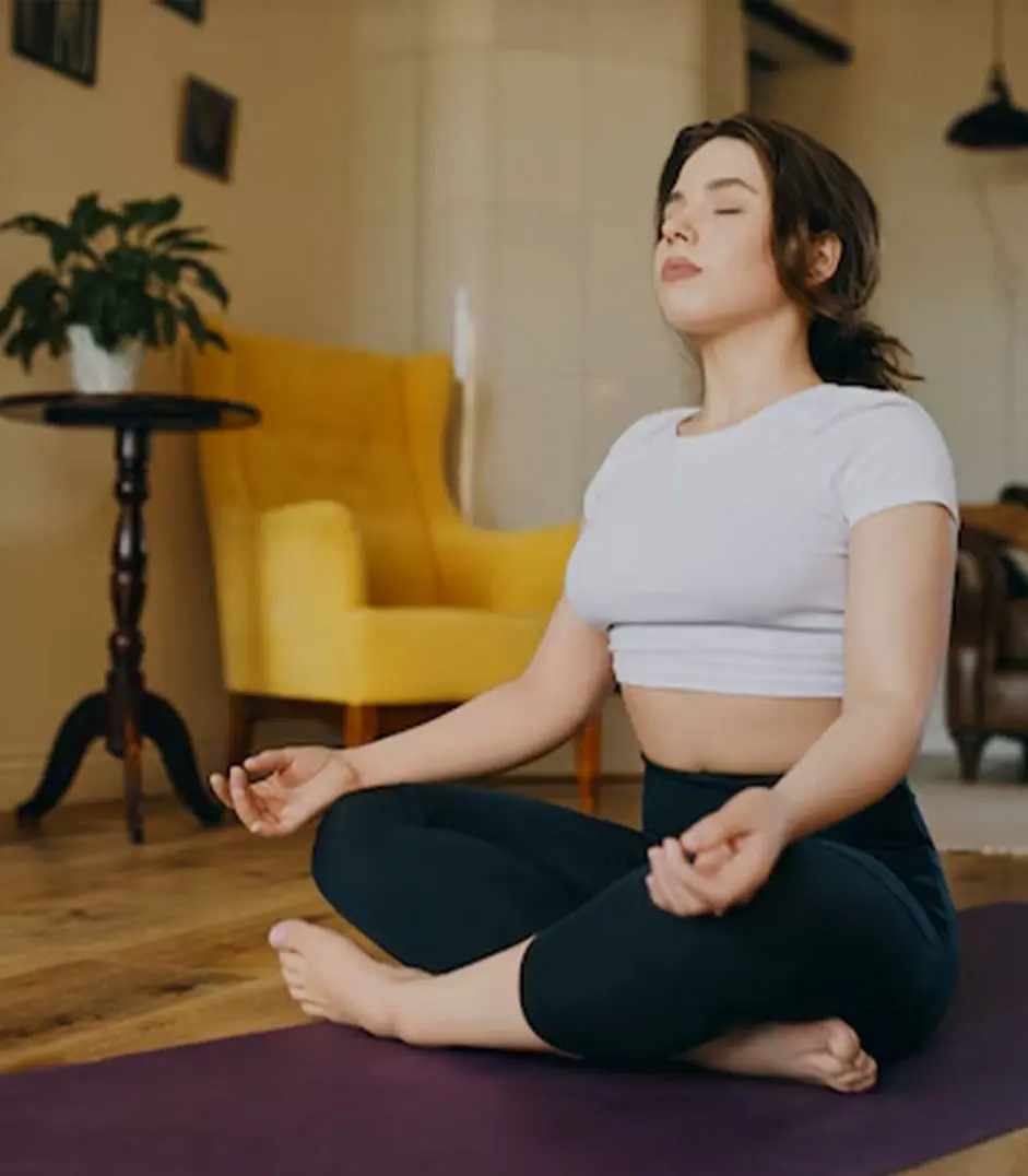 Individual practicing meditation and breathwork exercises for mindfulness, emotional healing, and holistic wellness