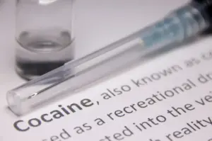 Close-up image illustrating cocaine as an illicit stimulant drug associated with binge use, health risks, and cocaine addiction