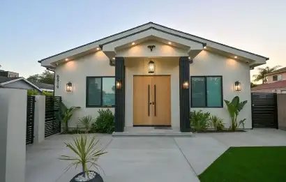 Front entrance of a modern private rehab residence in Los Angeles featuring clean architecture, landscaped greenery, and a discreet residential treatment setting.